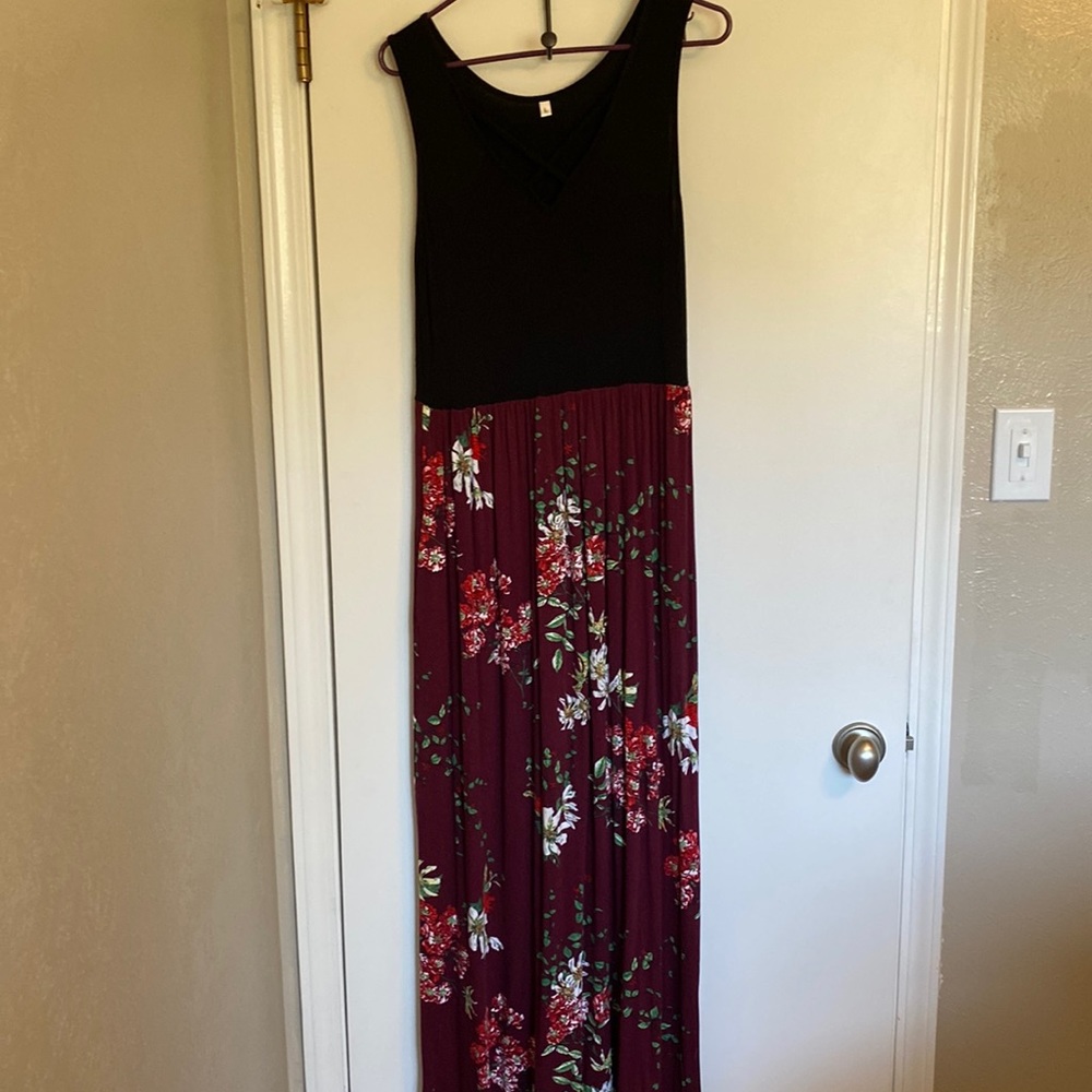 Tank-too maxi dress with v-neck on top and long maroon skirt.